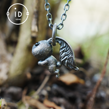 Kaninchenanhänger – springendes Häschentotem mit Onyxaugen, handgefertigtes Tieramulett, Symbol des Erwachens und Neubeginns