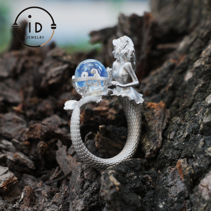 Handmade silver ring with seated mermaid and aquamarine stone, symbolic fantasy jewelry gift for women and ocean-inspired fairytale lovers