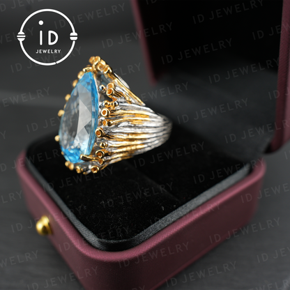 Handgefertigter blauer Topasring | einzigartiger Tropfen-Edelstein | Vintage-Silberring mit goldenen Akzenten | Boho-Schmuck | Statement-Edelsteinring 