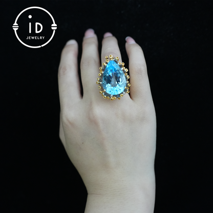 Handgefertigter blauer Topasring | einzigartiger Tropfen-Edelstein | Vintage-Silberring mit goldenen Akzenten | Boho-Schmuck | Statement-Edelsteinring 